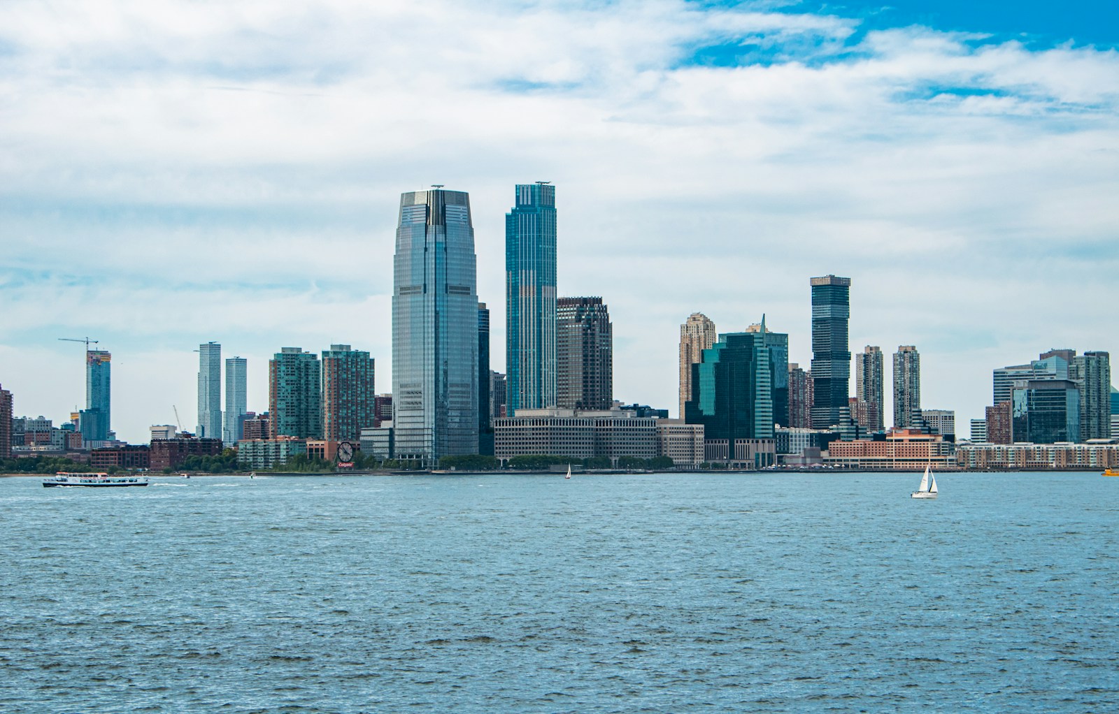 A large body of water with a city in the background