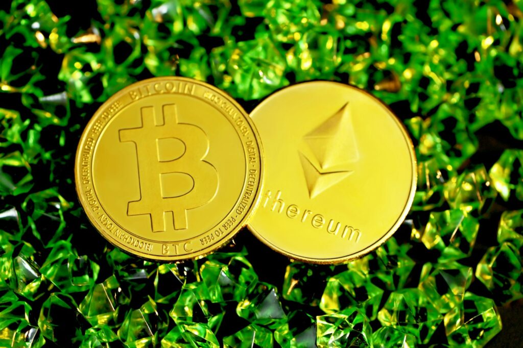 gold round coin on green grass