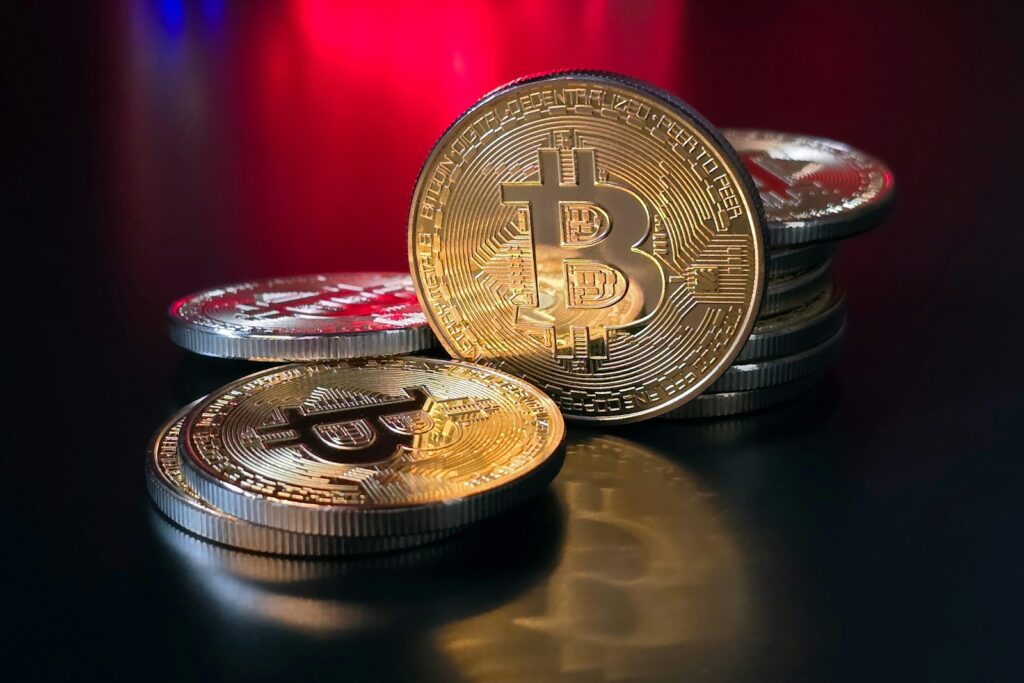 a pile of bitcoins sitting on top of a table