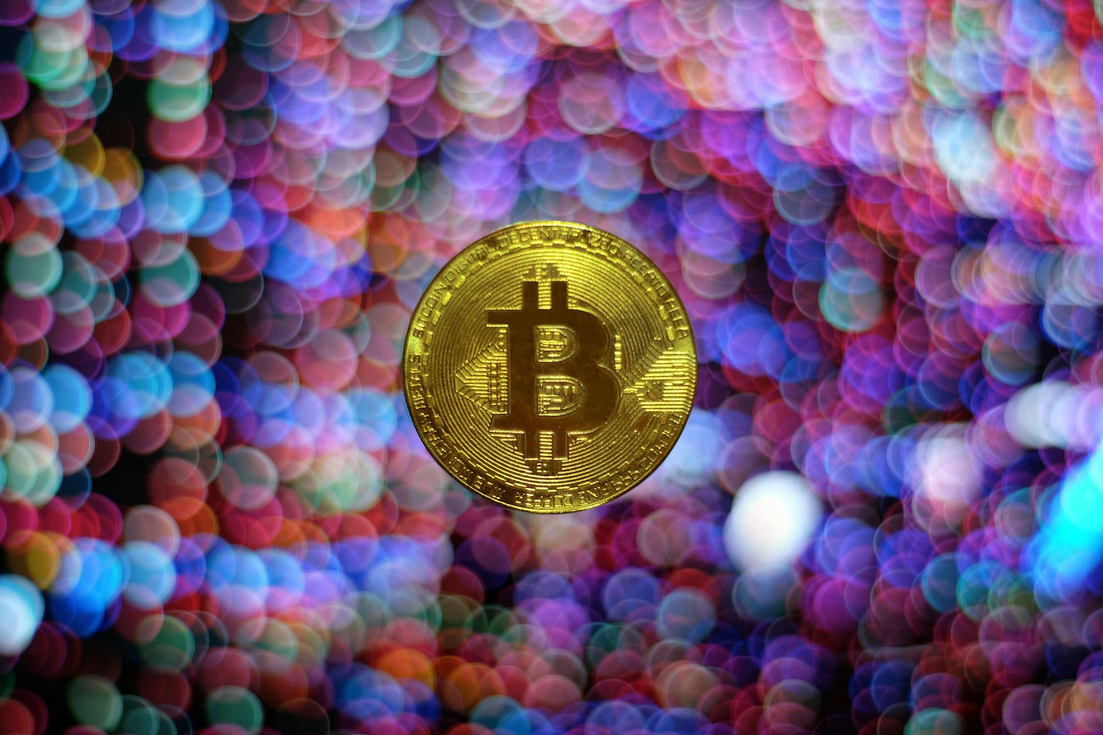 round gold-colored Bitcoin illustration