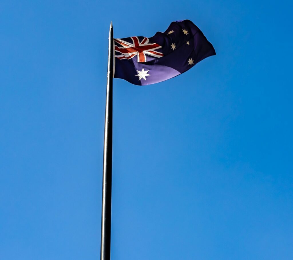 blue white and red flag under blue sky during daytime