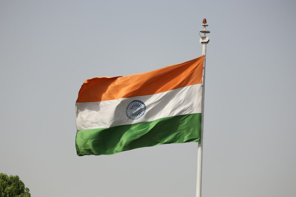 the indian flag is flying high in the sky