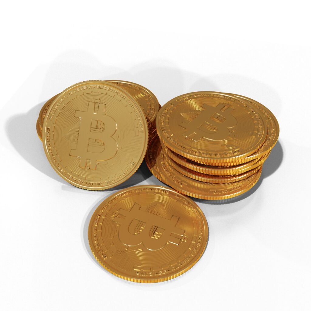 a pile of gold bitcoins sitting on top of each other