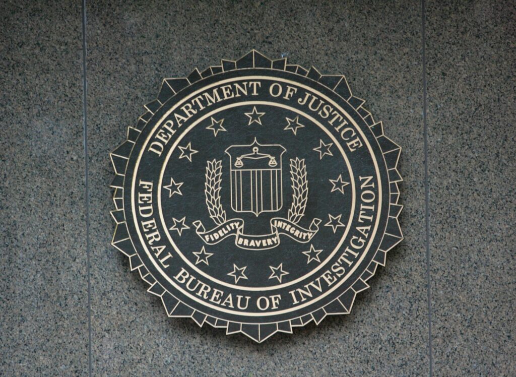 the seal of the department of justice on a wall