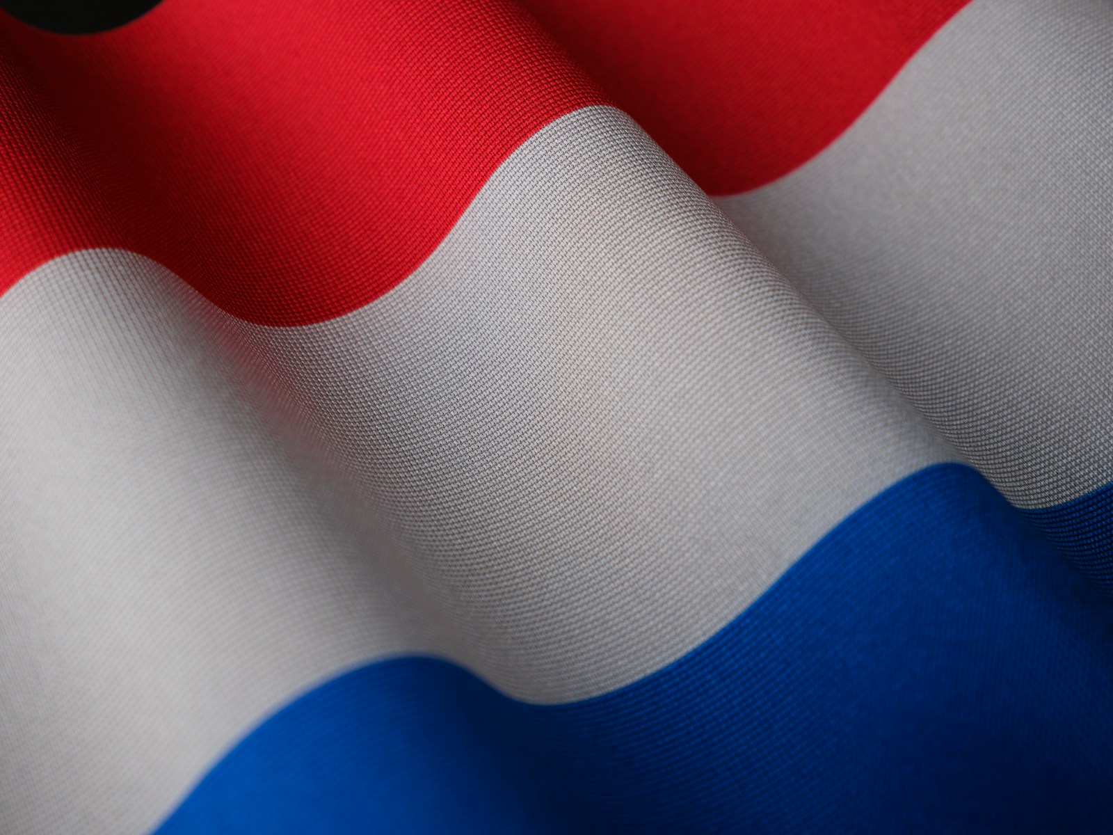 a close up of a red white and blue flag