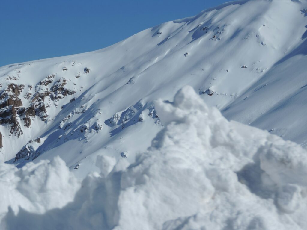 snow covered mountain under blue sky during daytime