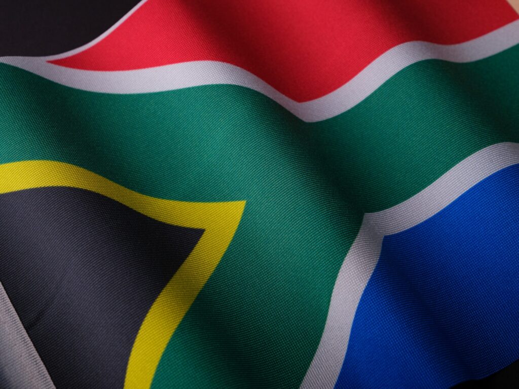 the flag of south africa is waving in the wind