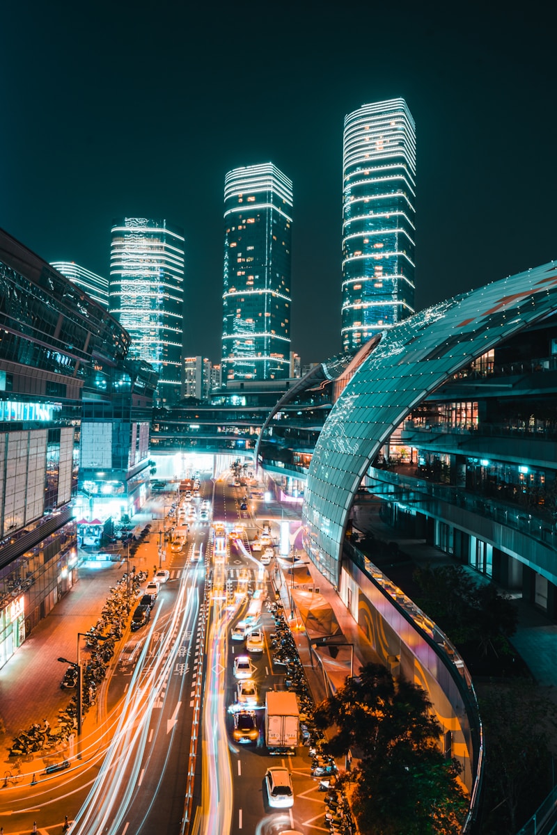 a city street filled with lots of traffic at night