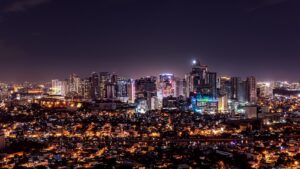 city with high rise buildings during night time