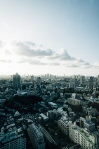 Expansive cityscape with buildings under a cloudy sky