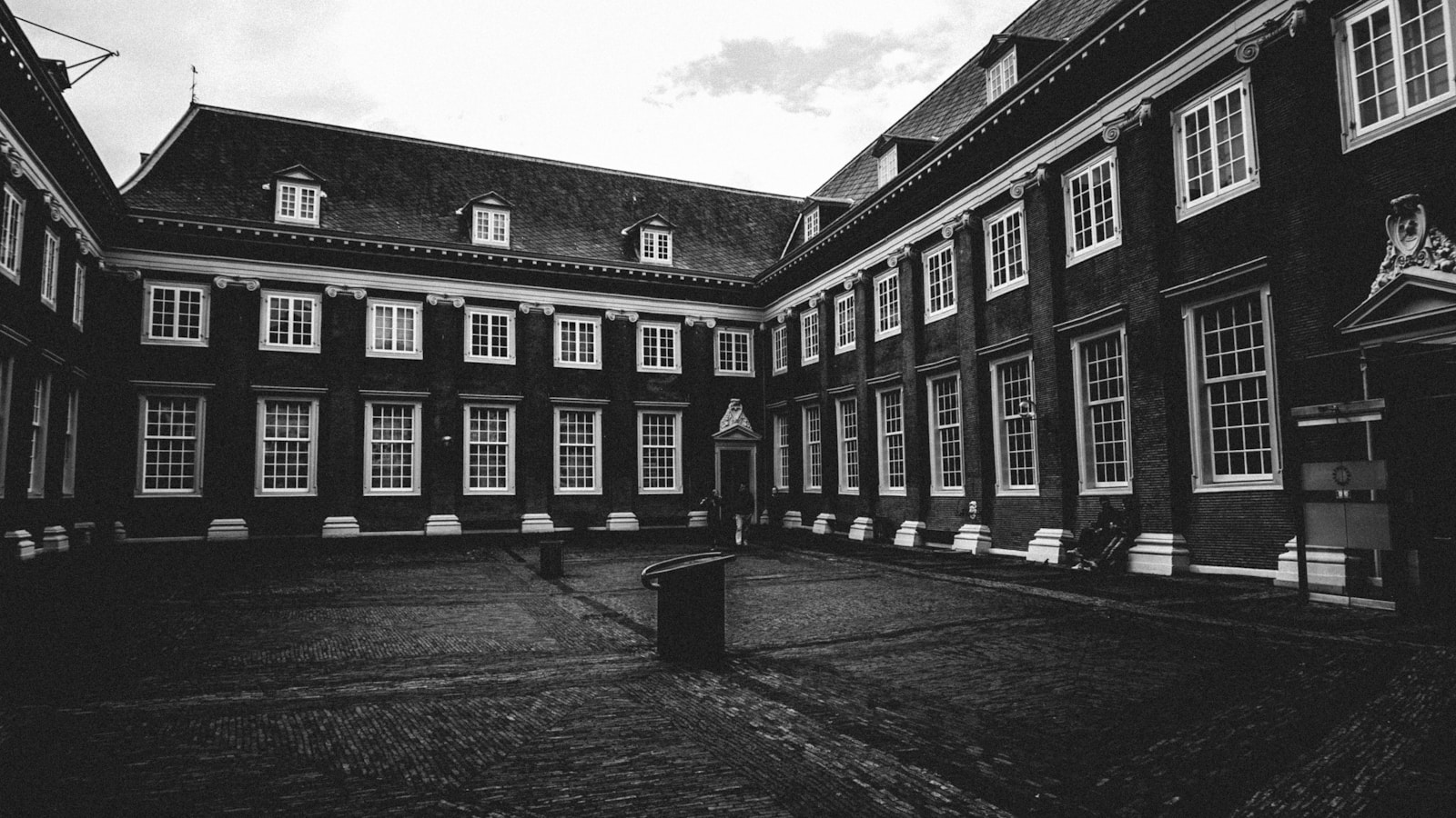a black and white photo of a courtyard