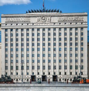 A large white building with a flag on top of it