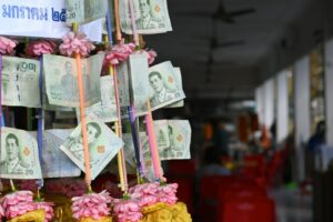 a bunch of money hanging from a ceiling