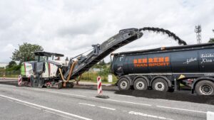 Asphalt milling machine working on road construction in Geesthacht, Germany.
