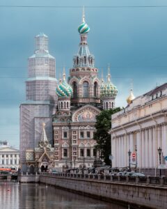 A city with tall buildings and a body of water