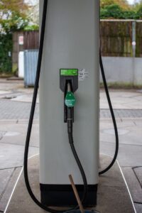 E10 green fuel pump nozzle at a deserted gas station in Bergisch Gladbach, Germany.