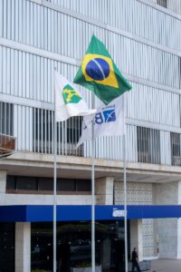 Flags waving outside Banco do Brasil headquarters in Brasília, Distrito Federal. Iconic Brazilian location indoors.