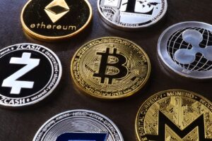 Detailed view of assorted cryptocurrency coins including Bitcoin, Ethereum, and Ripple.