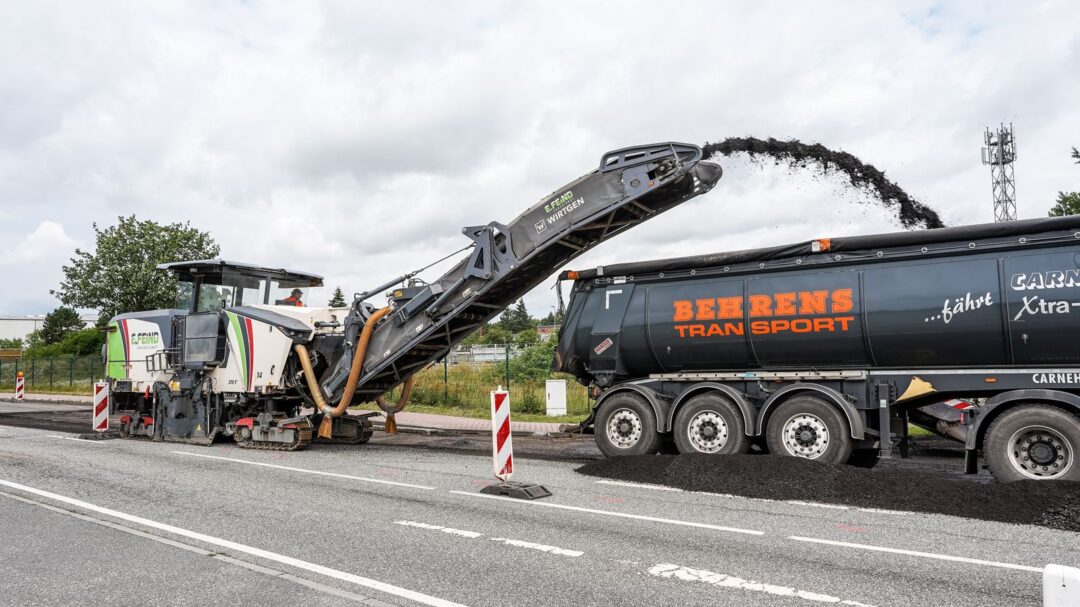 Asphalt milling machine working on road construction in Geesthacht, Germany.