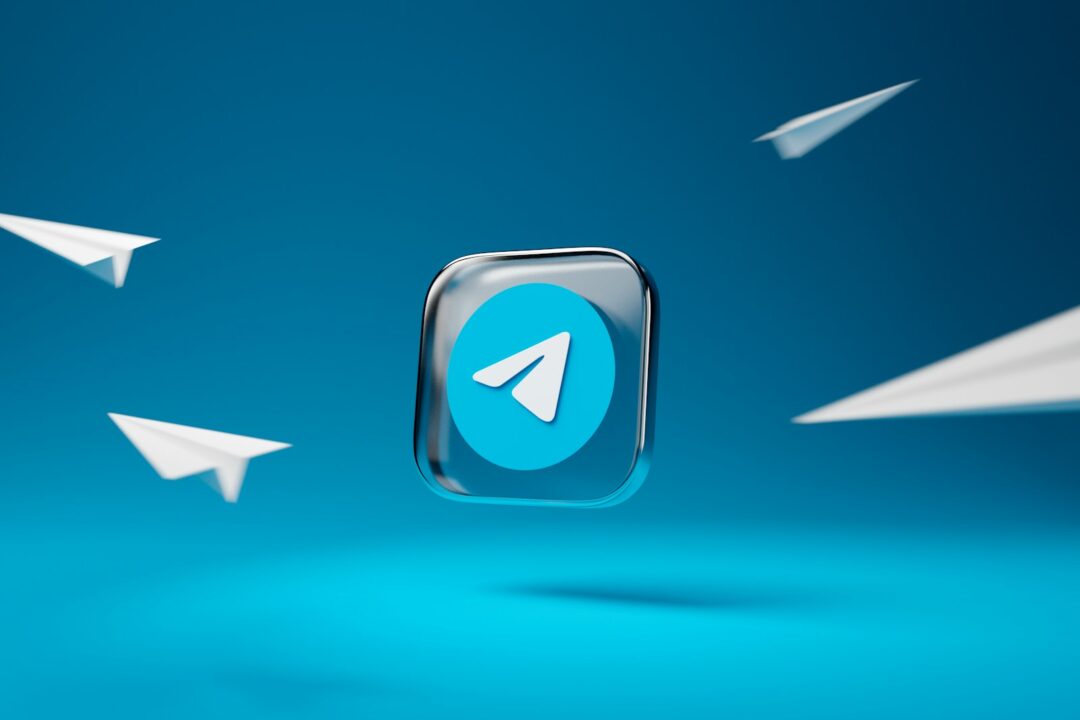 a blue button with a white arrow on it