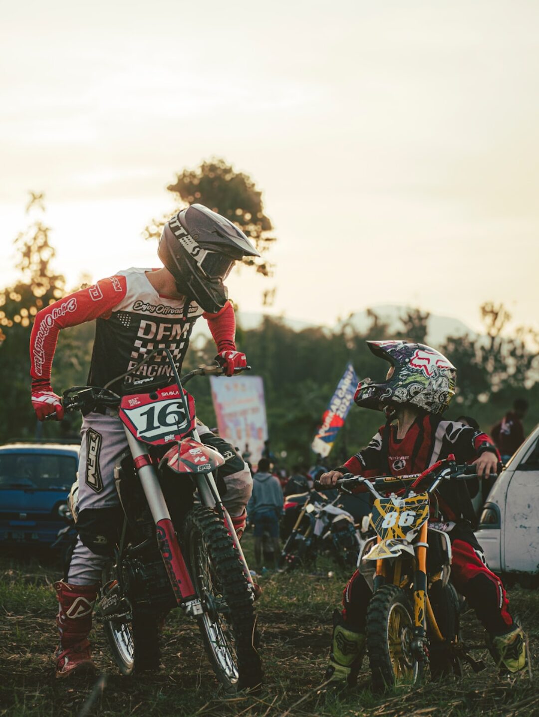 A man riding a dirt bike on top of a field