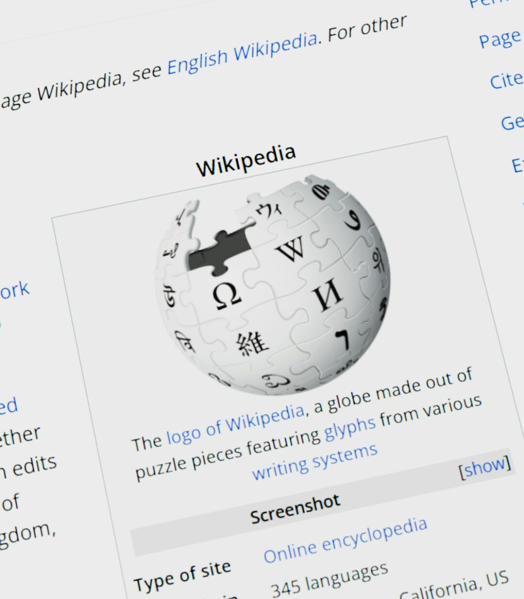 Wikipedia logo globe with text on screen